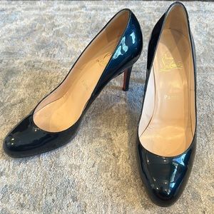 Christian Louboutin dark navy (almost black) round toe patent heels.